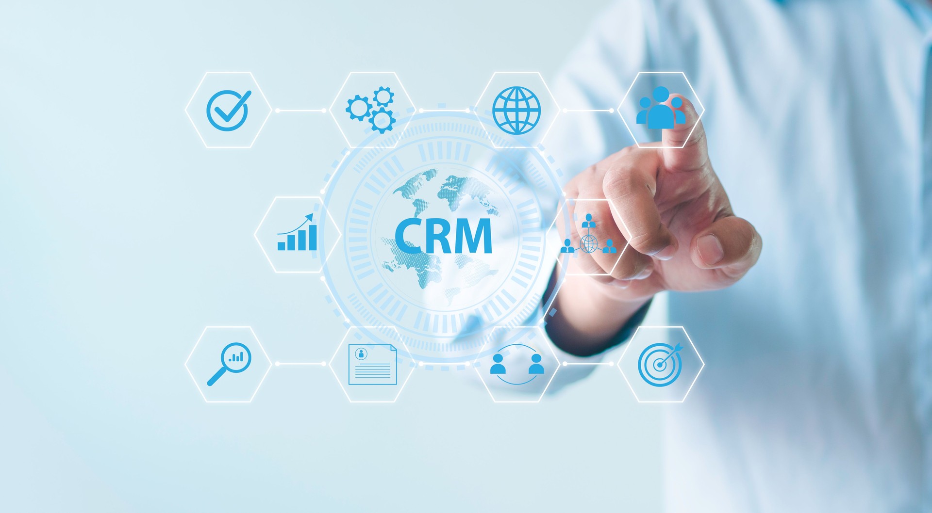 CRM customer relationship management for business sales development and digital marketing system concepts Businessman taps button on futuristic technology integrating CRM services for business